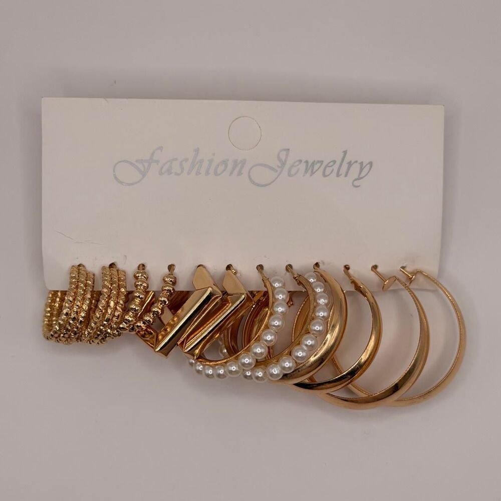 6 sets of gold tone hoop earrings with pearl accents